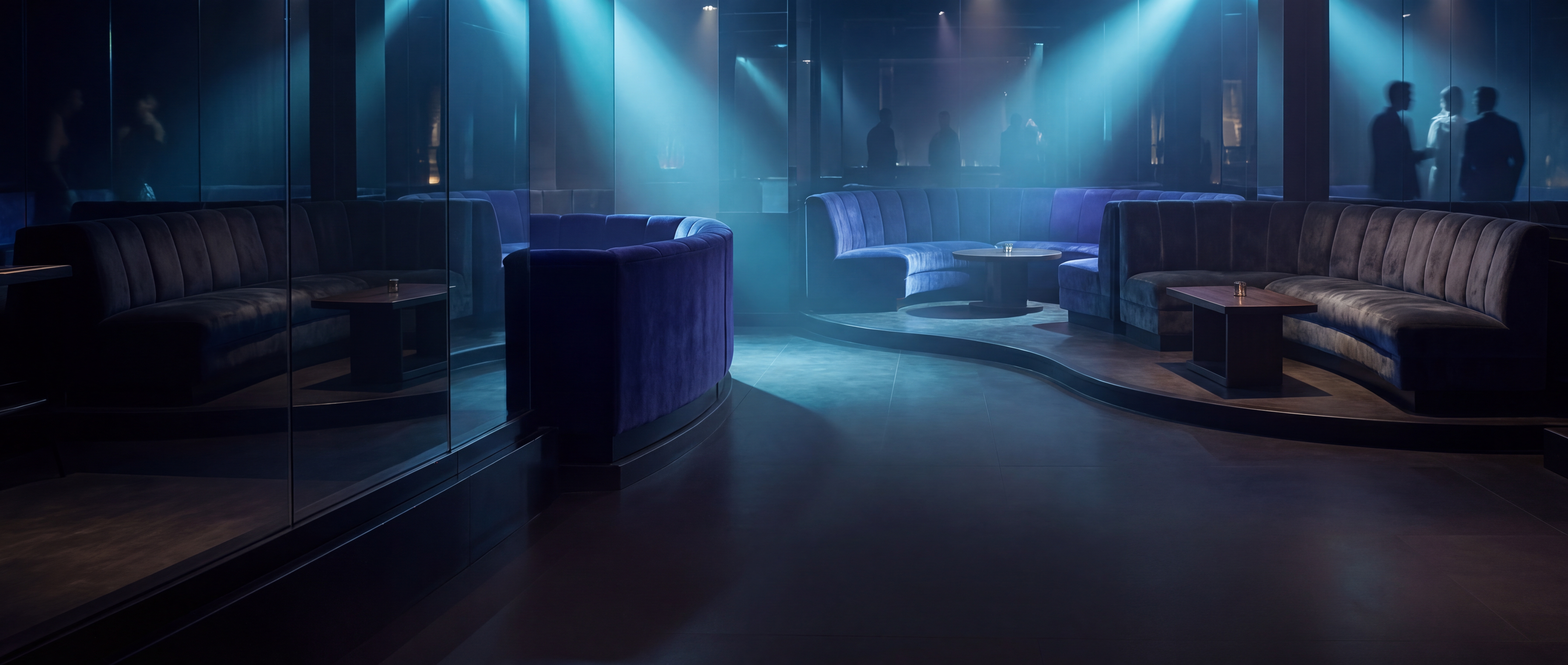 A moody upscale lounge interior with atmospheric lighting and dark negative space.